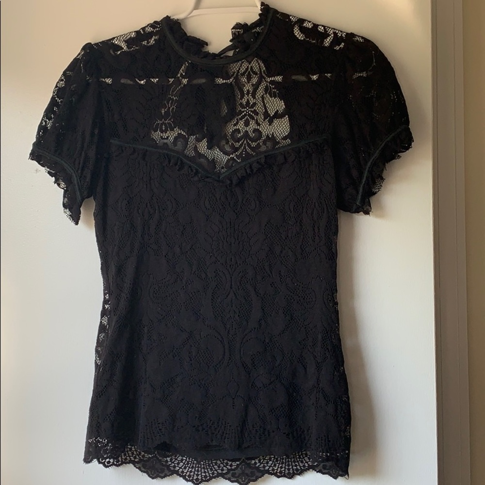 Bebe Sz M lace top with open back and high neck.